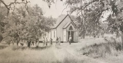 St. Luke's Episcopal Church at Jolon, built in 1884 by Reason Plaskett and his brothers Robert and Marion — parishioners gathered among the oaks