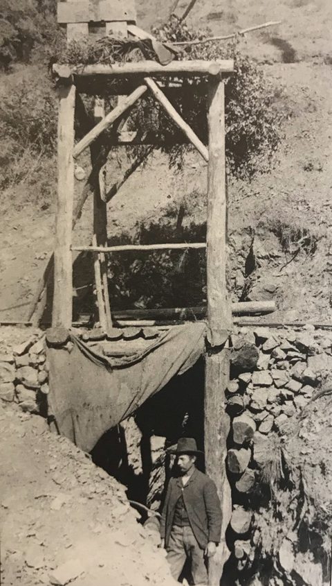 William D. Cruikshank at the timbered shaft of the Last Chance Mine, Los Burros, c. 1889