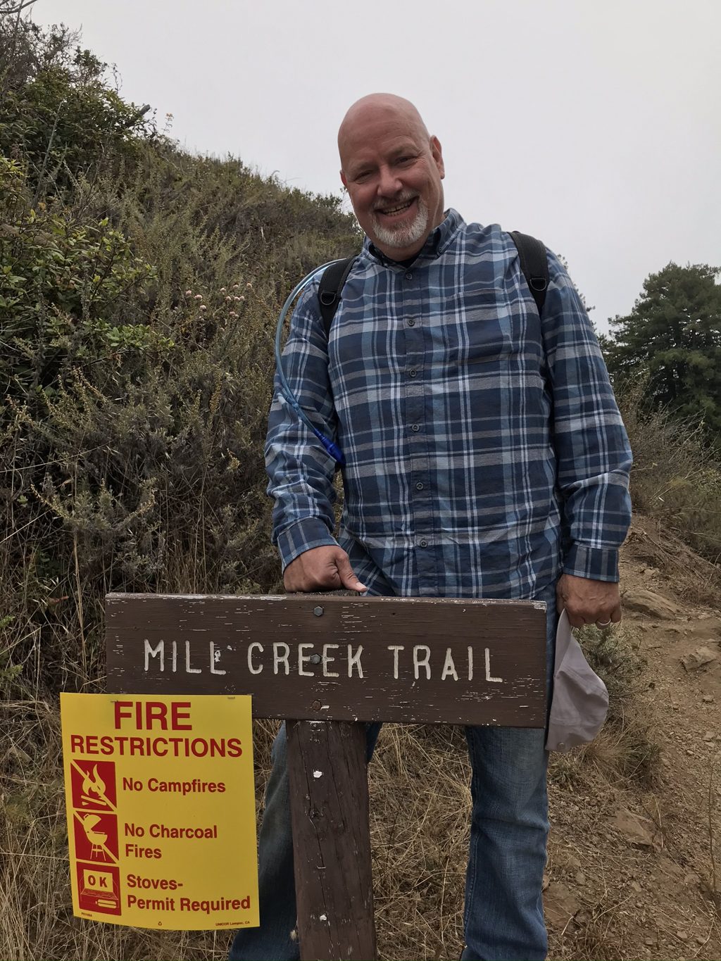 Bill "Bull Plaskett" Alderson at the Mill Creek Trail trailhead, starting the hike up the canyon where his great-grandfather E.R. Sans ran his sawmill and grandmother Mabel Sans Plaskett spent her childhood.