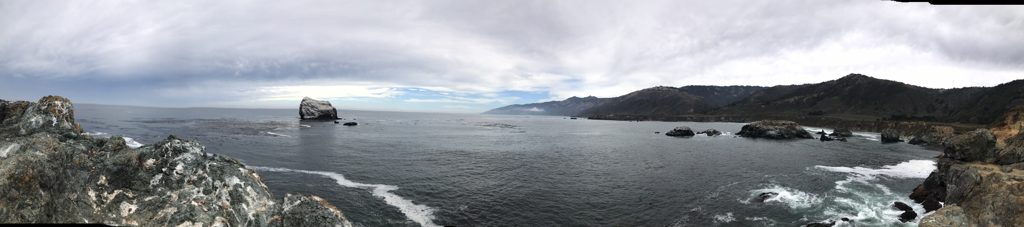Full sweep of the bay from the point: Plaskett Rock, the sea stacks, and the coast running north toward Cone Peak country.