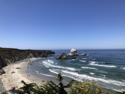 Sand Dollar Beach in full sun, Plaskett Rock standing guard.